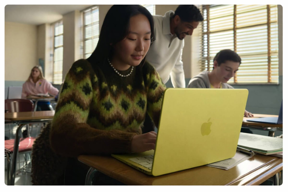 Student using MacBook Neo laptop for study in classroom
