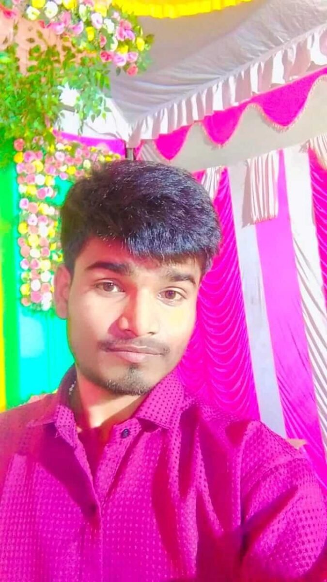 young man portrait photo with colorful wedding decoration background and bright lighting