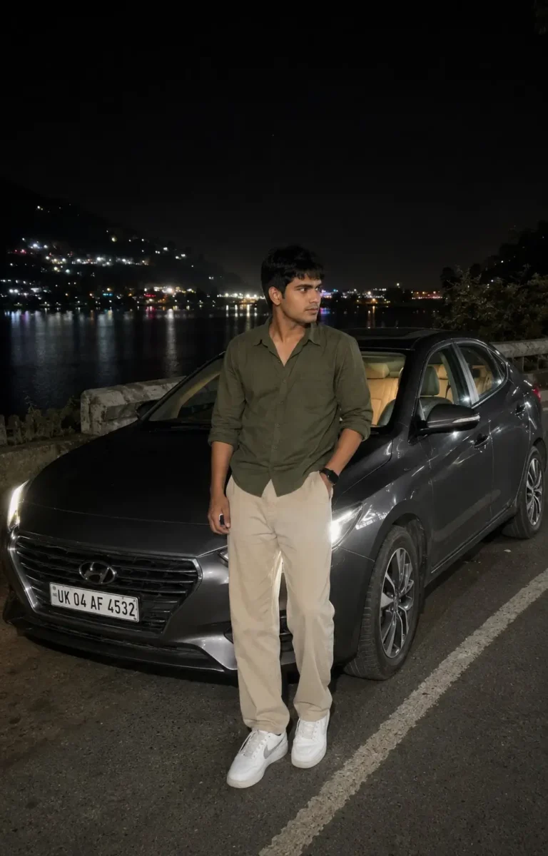 रात में lakeside road पर dark grey car के पास खड़ा युवक